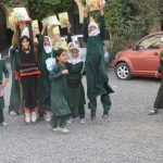 Schoolgirls celebrating with copies of Seyaj magazine
